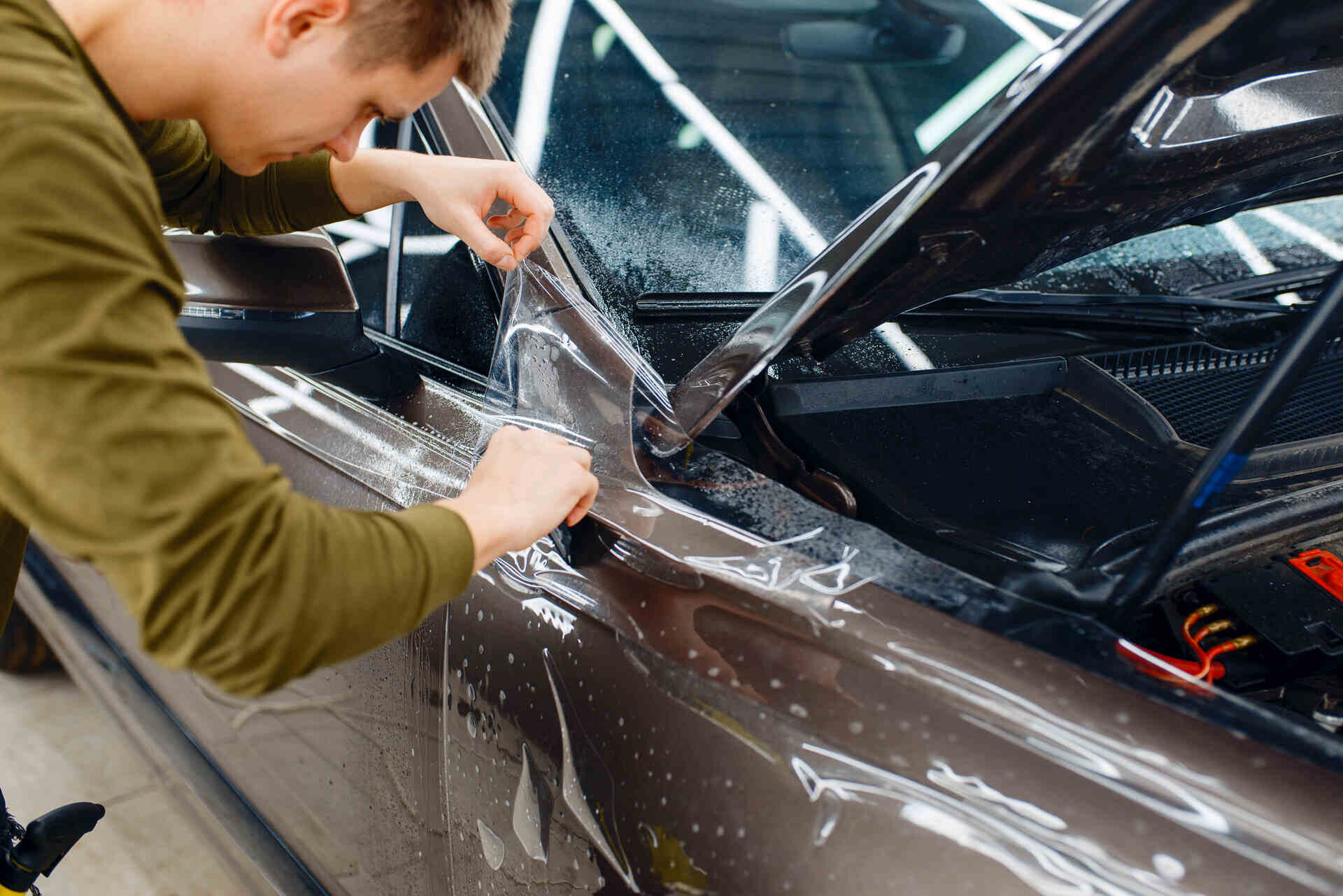 paint protection film being installed on a car in Tx