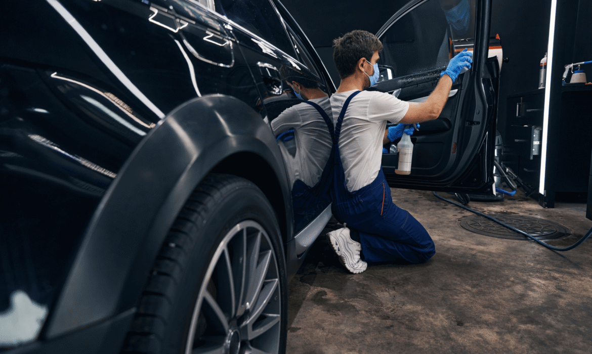Waterwerkz Employee Providing Professional Detailing To A Car Interior