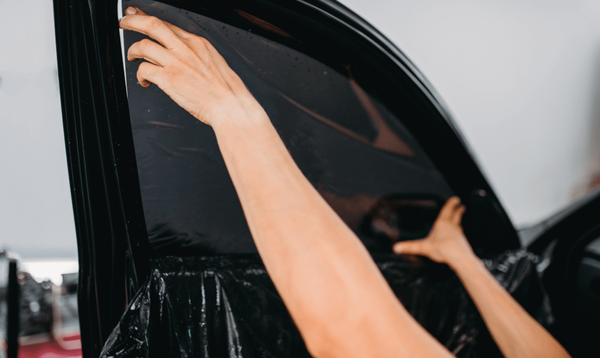 Window Tint Being Installed On A Car At Waterwerkz